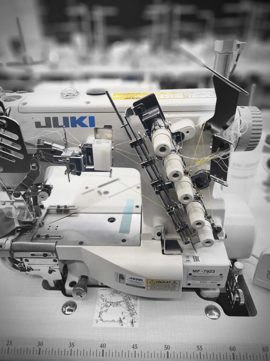 Close-up of a threaded Juki industrial sewing machine