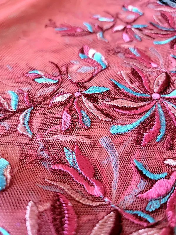 Pink tulle with pink and turquoise floral embroidery