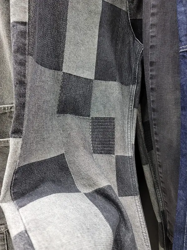 Denim made of grey and black washed patches